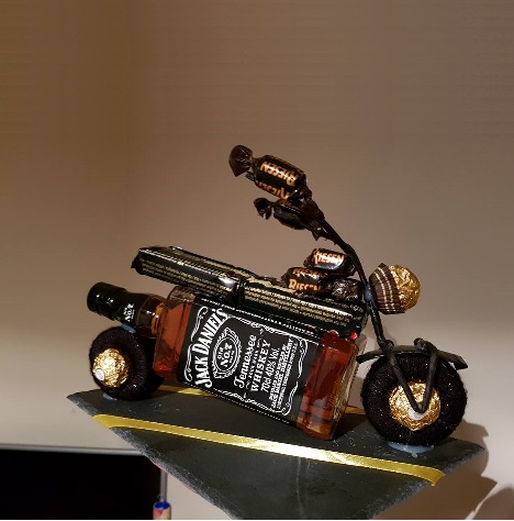 motorcycle made from whiskey bottle with candy