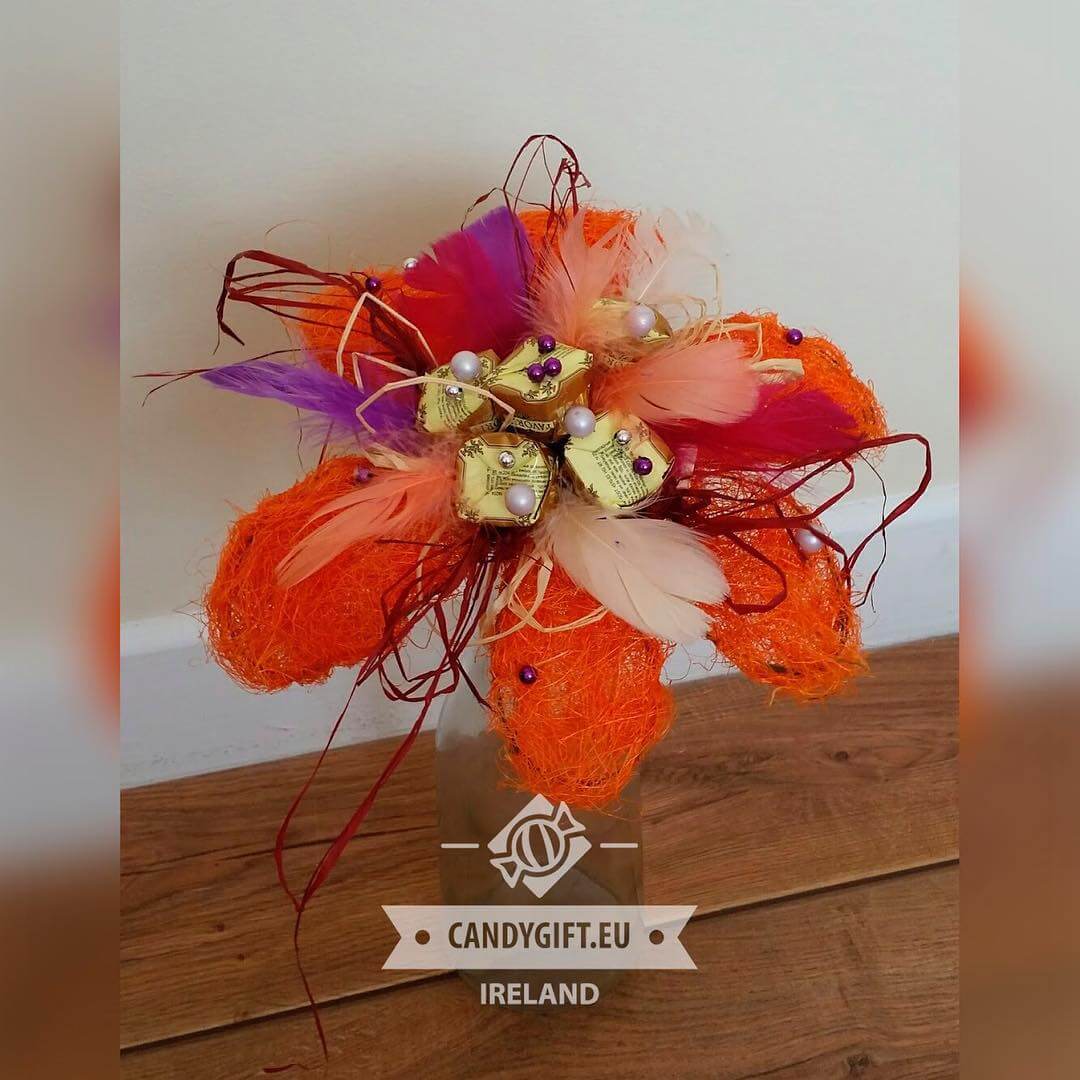 orange artificial flower and candy