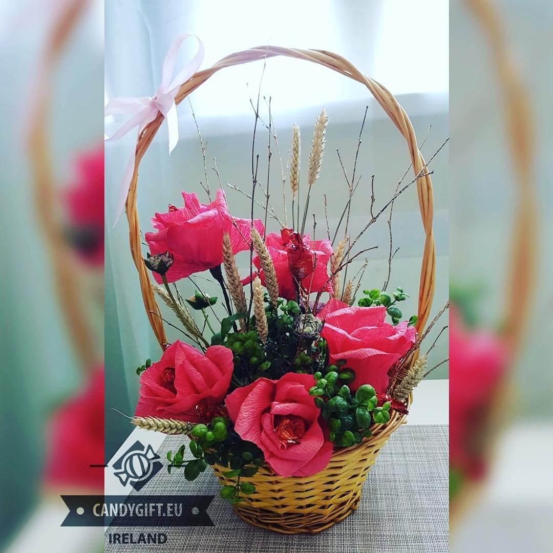 gift basket with artificial roses and candy