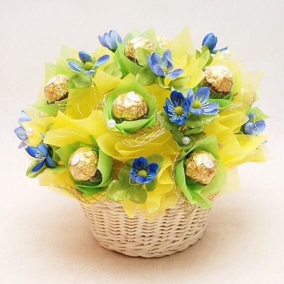 gift basket with artificial forget-me-nots and candy